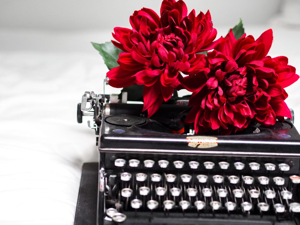 Typewriter and flowers